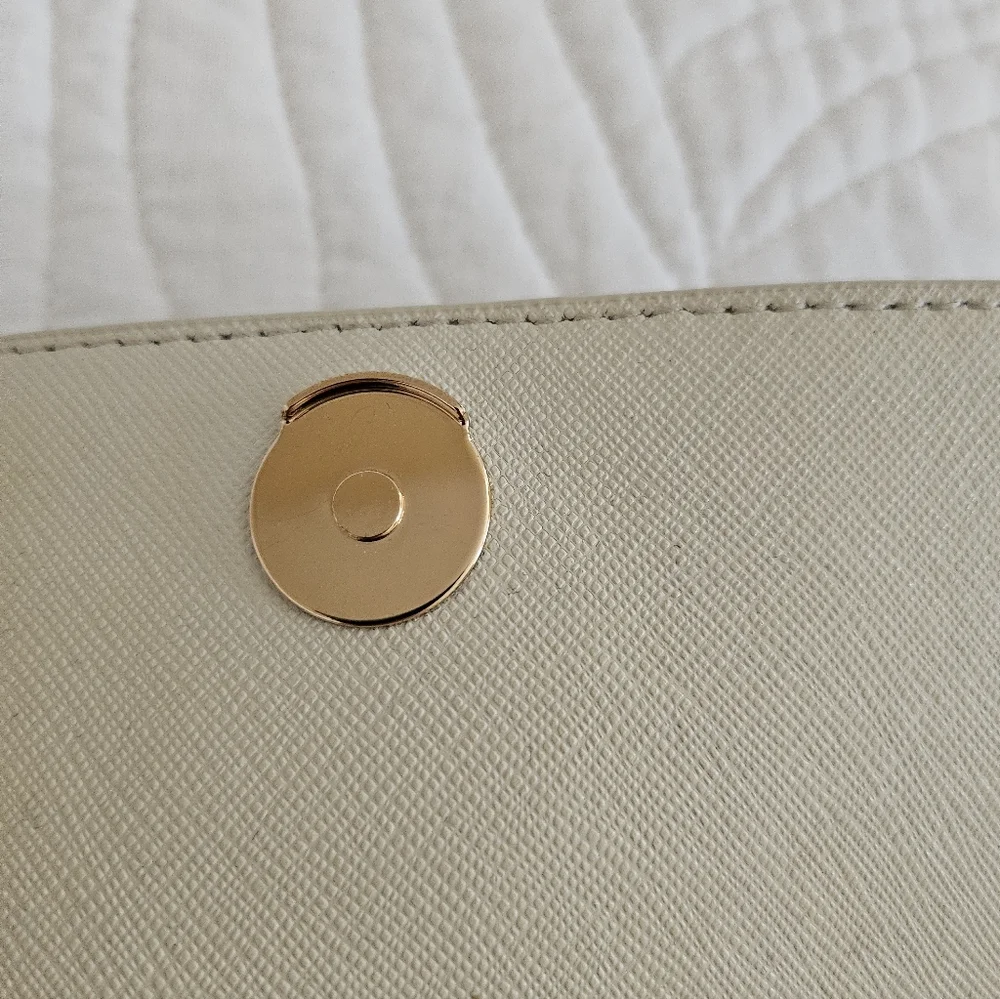 Tory Burch Robinson perforated leather mini crossbody clutch in off-white